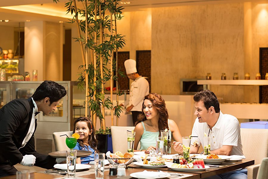 Family being served at a celebration lunch