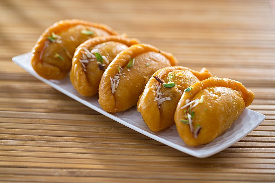 Indian sweets garnished with pistachio and almond